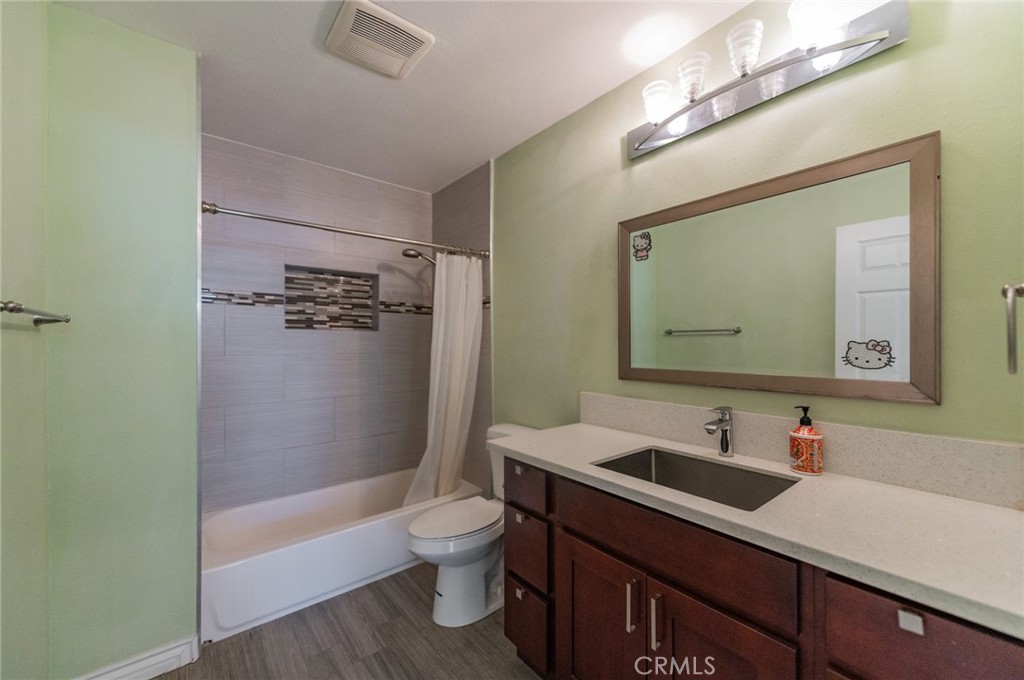9163 Duarte Road San Gabriel, CA 91775 - Photo 23 of 38 a bathroom with a sink a toilet and shower