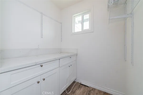 a view of storage and utility room with window