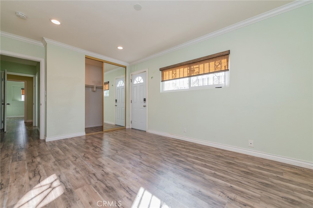 9163 Duarte Road San Gabriel, CA 91775 - Photo 26 of 38 a view of empty room with wooden floor and fan