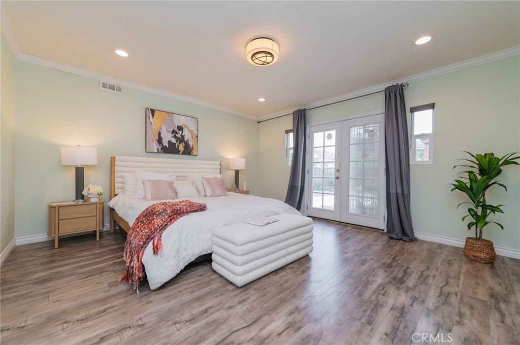 9163 Duarte Road San Gabriel, CA 91775 - Photo 30 of 38 a spacious bedroom with a bed and a potted plant
