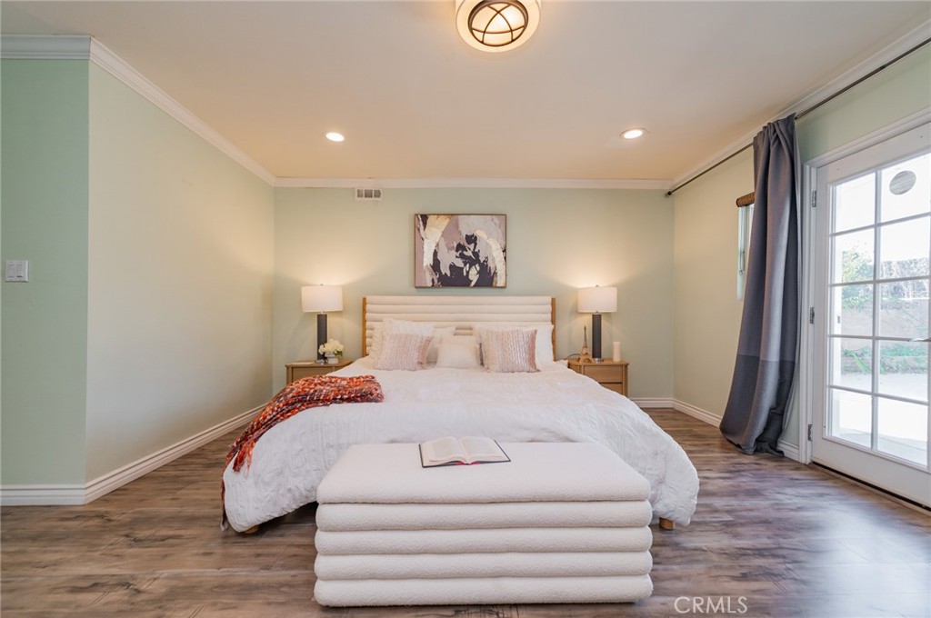 9163 Duarte Road San Gabriel, CA 91775 - Photo 31 of 38 a bedroom with a bed and a large window