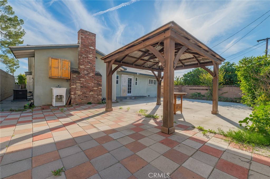 9163 Duarte Road San Gabriel, CA 91775 - Photo 37 of 38 a view of a porch with a table and chairs and potted plants