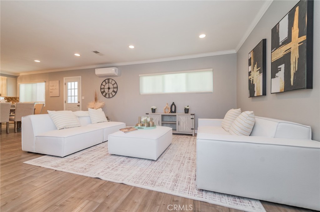 9163 Duarte Road San Gabriel, CA 91775 - Photo 6 of 38 a living room with furniture and a wooden floor