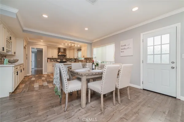 a view of a dining room with furniture and a livingroom