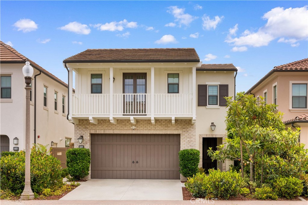 114 Omar Irvine, CA 92620 - Photo 1 of 25 a front view of a house with a garage