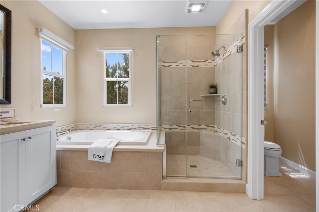 114 Omar Irvine, CA 92620 - Photo 15 of 25 a bathroom with a bathtub and a shower