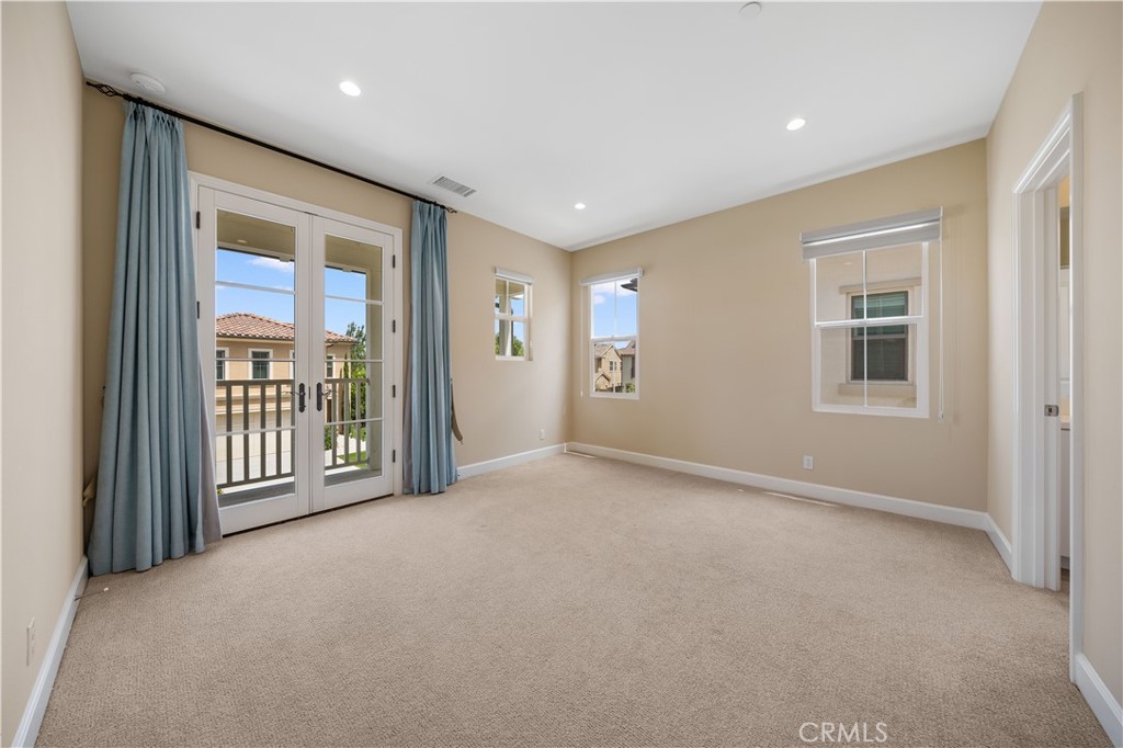 114 Omar Irvine, CA 92620 - Photo 17 of 25 a view of a big room with windows and chandelier fan
