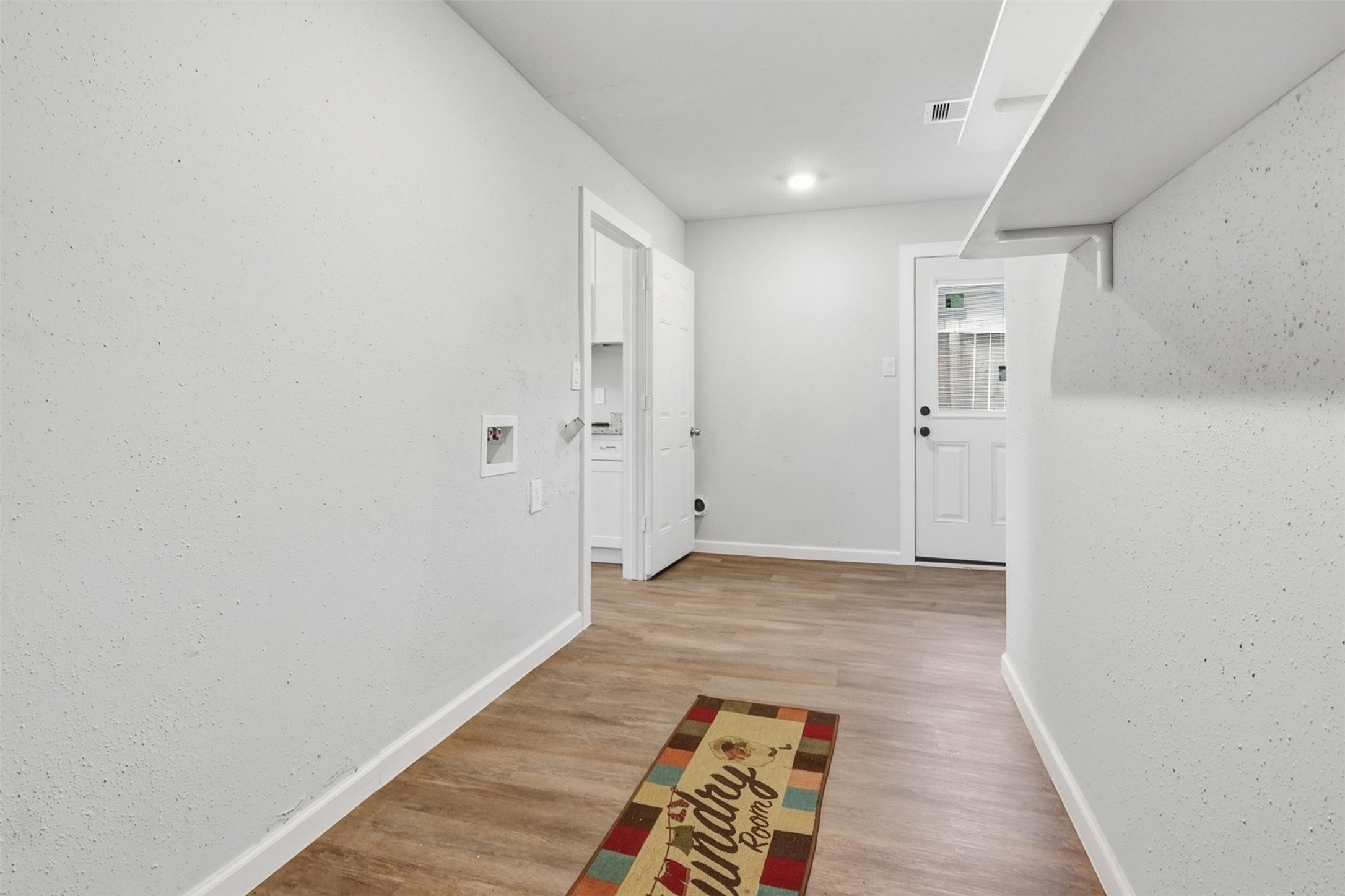 4767 Beechaven Street Houston, TX 77053 - Photo 8 of 26 a view of hallway with wooden floor