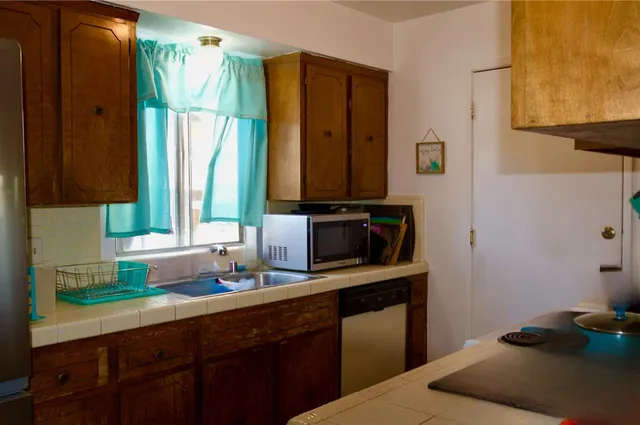 a kitchen with a sink and a window