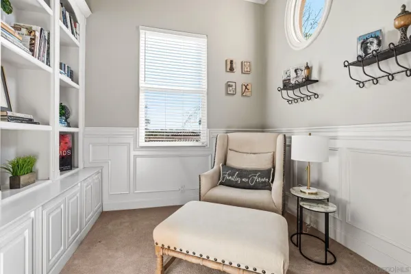 a bedroom with furniture and a window
