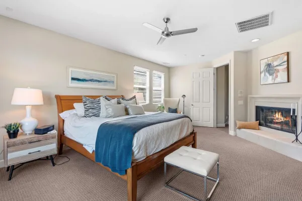 a spacious bedroom with a bed and a couch