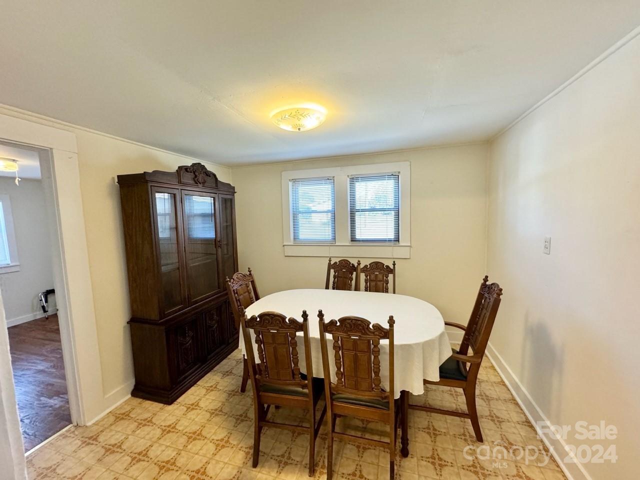 565 Neely Road Brevard, NC 28712 - Photo 13 of 30 a view of a dining room with furniture and a window