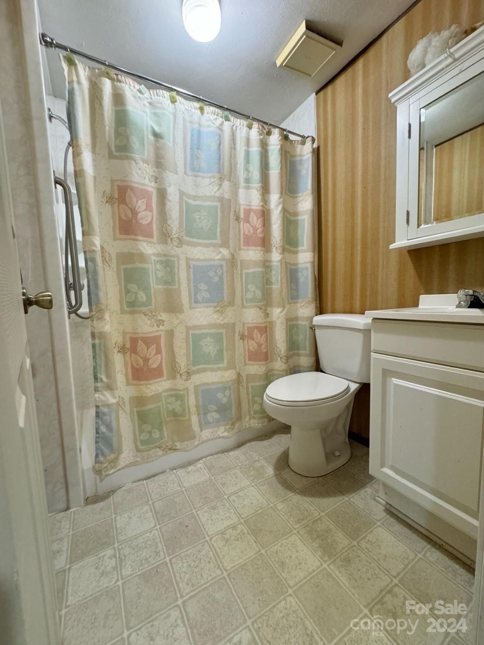 565 Neely Road Brevard, NC 28712 - Photo 17 of 30 a bathroom with a toilet and a shower