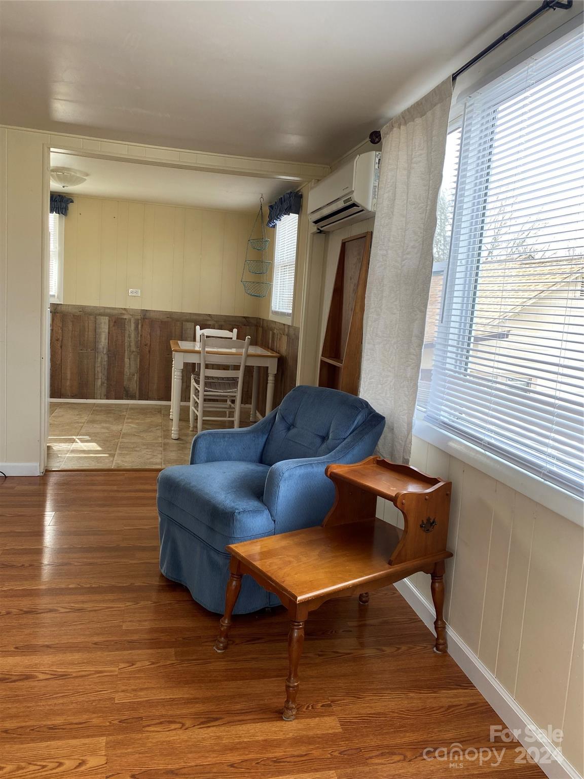 565 Neely Road Brevard, NC 28712 - Photo 19 of 30 a living room with furniture and a wooden floor