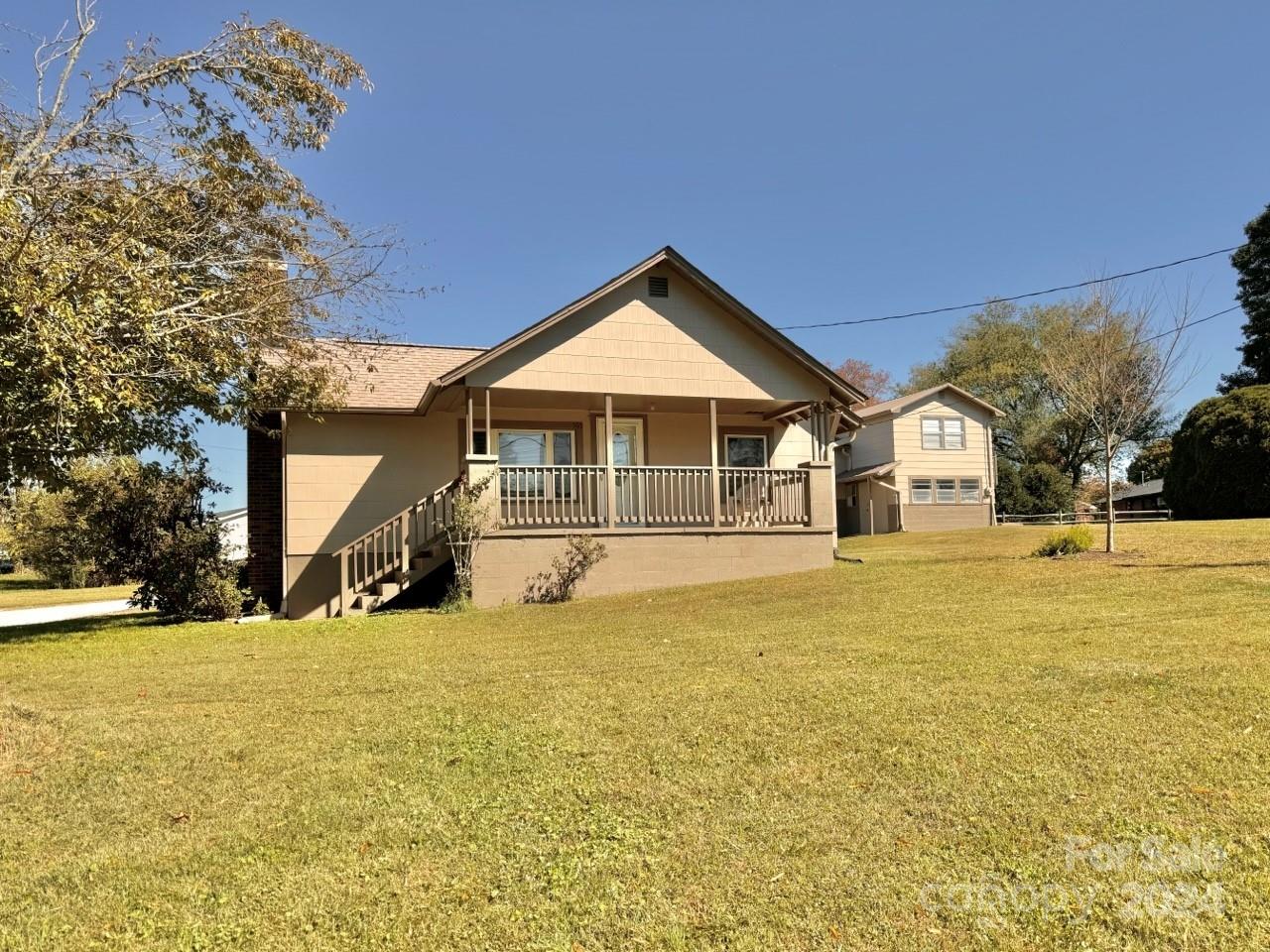 565 Neely Road Brevard, NC 28712 - Photo 2 of 30 a house with trees in the background