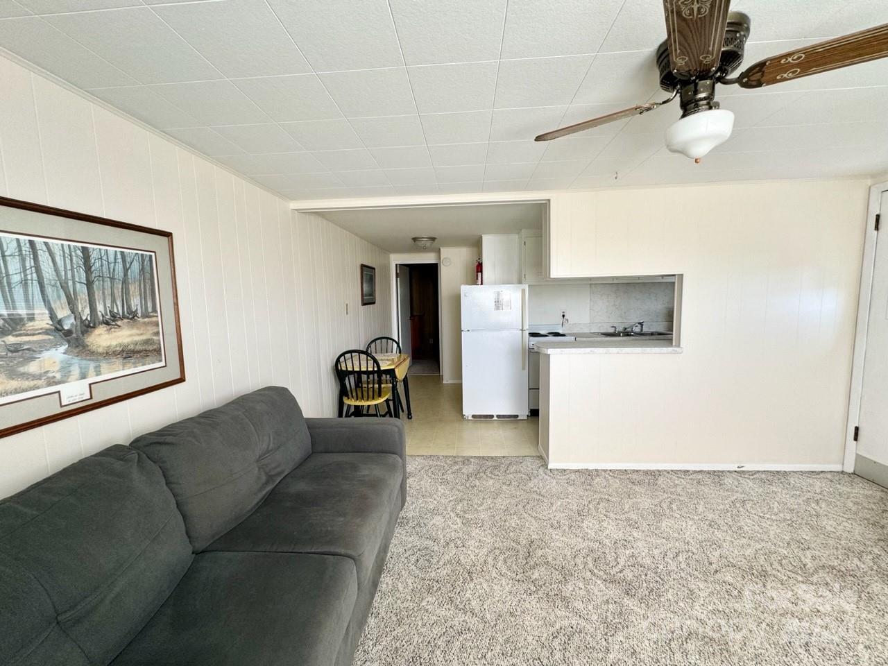 565 Neely Road Brevard, NC 28712 - Photo 24 of 30 a living room with furniture and a kitchen