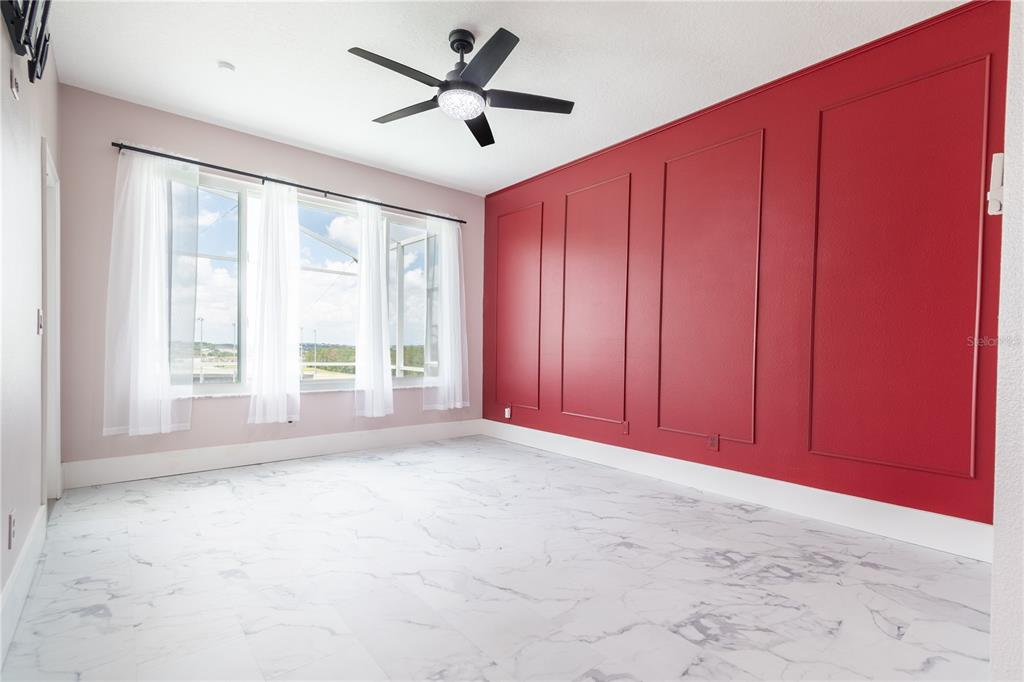 3862 Beacon Ridge Way Clermont, FL 34711 - Photo 15 of 56 an empty room with windows and fan