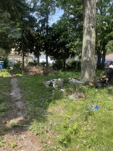 a backyard of a house with lots of green space