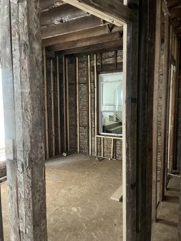 a view of a porch with wooden floor and fence