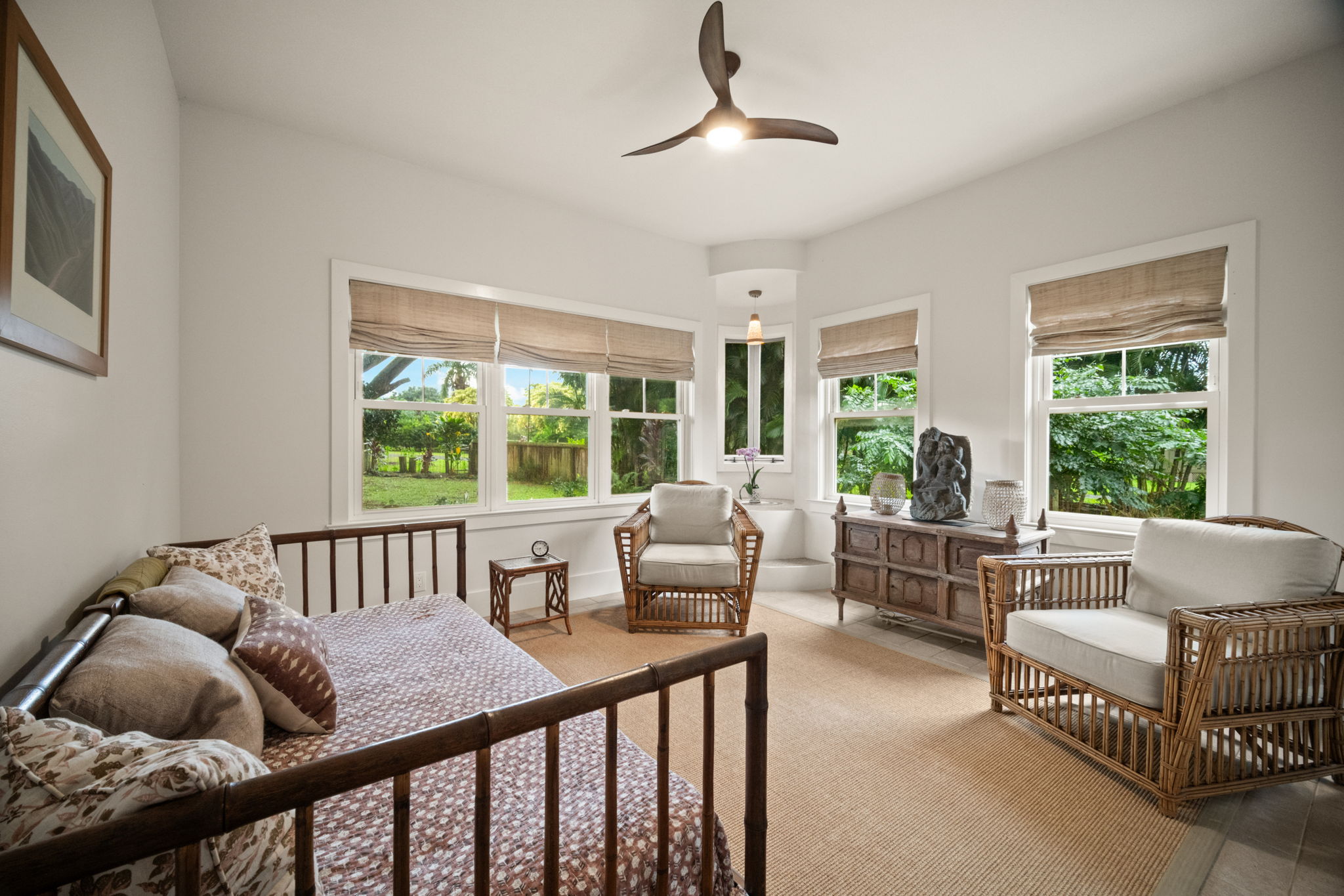 4691 Wailapa Road Kilauea, HI 96754 - Photo 14 of 30 a bedroom with furniture and a large window