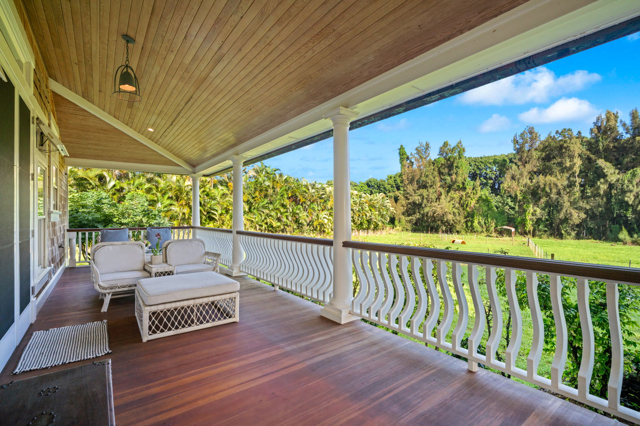 4691 Wailapa Road Kilauea, HI 96754 - Photo 21 of 30 a view of a patio with lawn chairs next to a yard