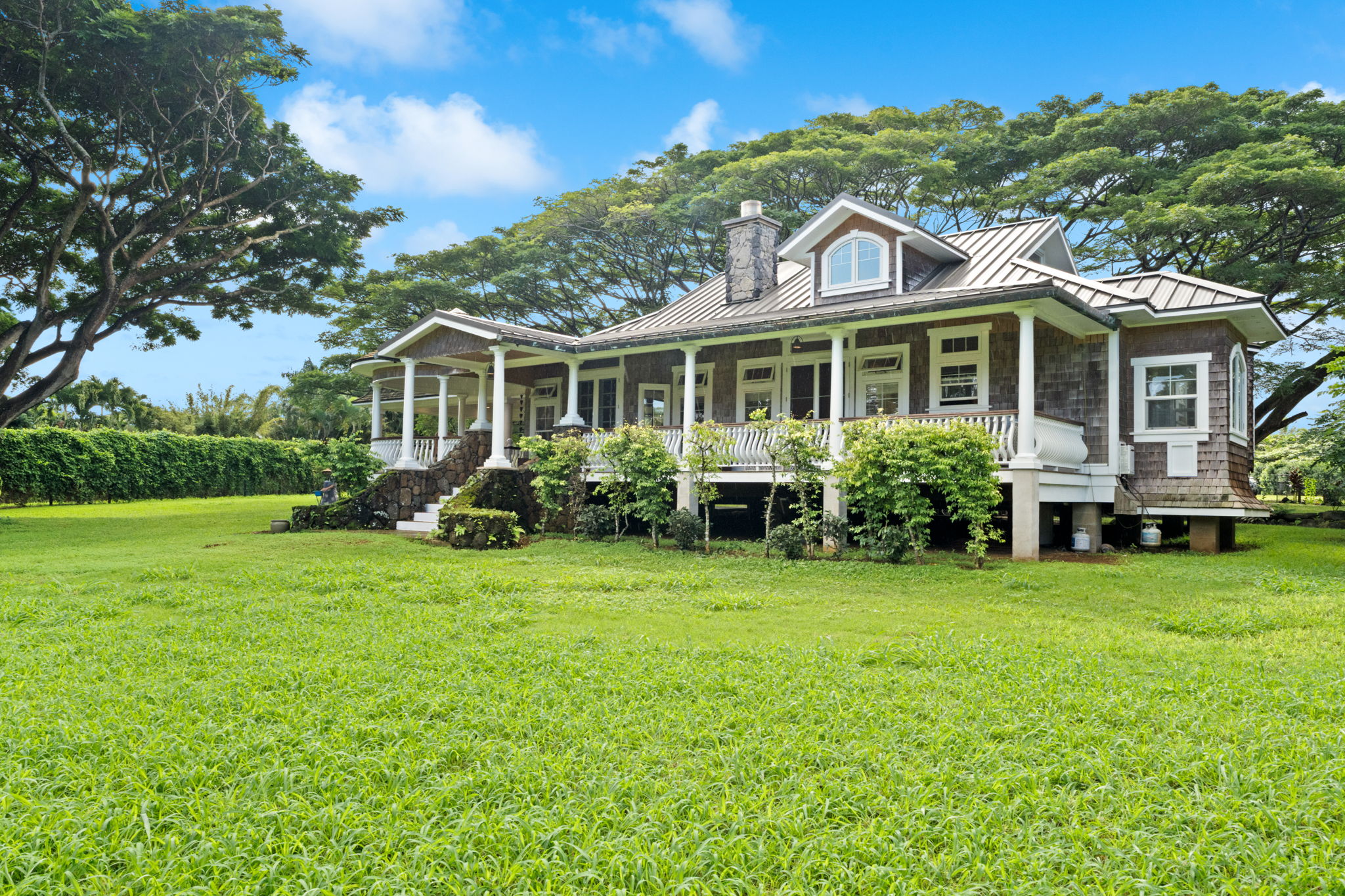 4691 Wailapa Road Kilauea, HI 96754 - Photo 25 of 30 a front view of a house with a garden