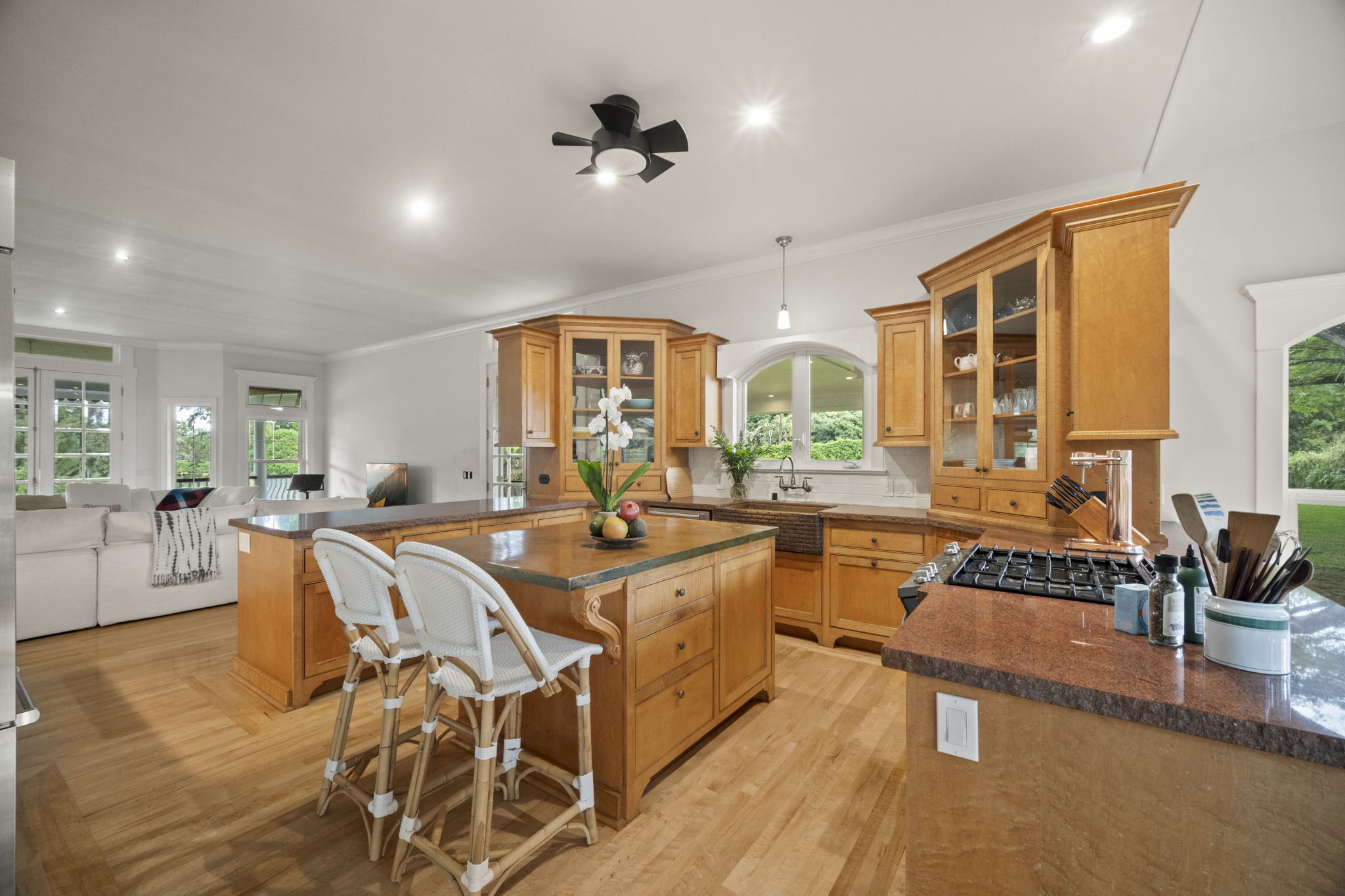 4691 Wailapa Road Kilauea, HI 96754 - Photo 7 of 30 a large white kitchen with a large window and stainless steel appliances