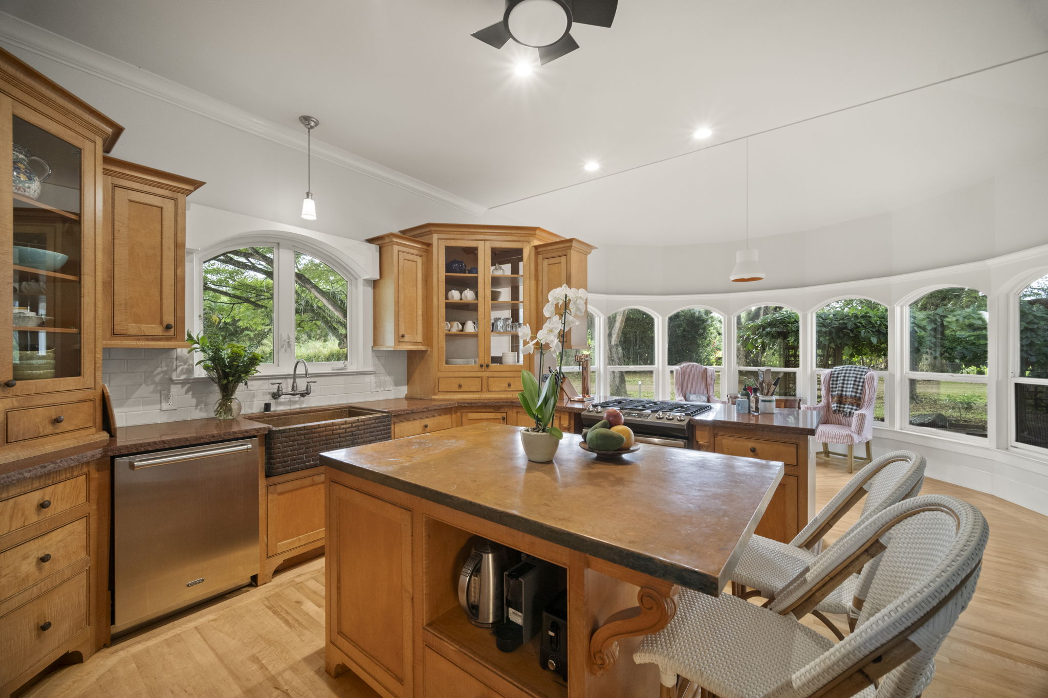 4691 Wailapa Road Kilauea, HI 96754 - Photo 8 of 30 a kitchen with stainless steel appliances kitchen island granite countertop a sink and cabinets