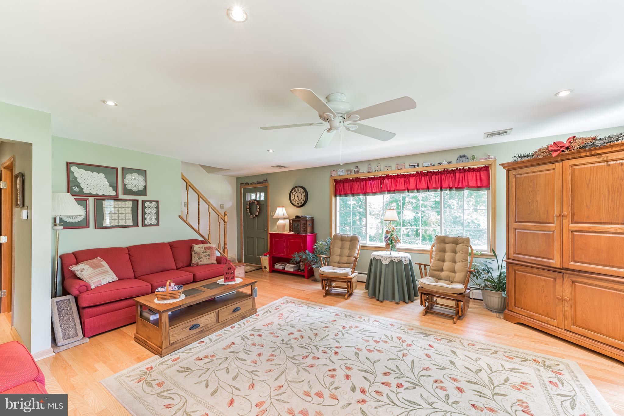 1335 Melvin Road Phoenixville, PA 19460 - Photo 11 of 38 Living Room w/ Picture Window Facing Woods/Trees