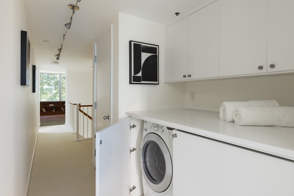 975 Memorial Drive, Unit 209 Cambridge, MA 02138 - Photo 15 of 23 a utility room with dryer and washer