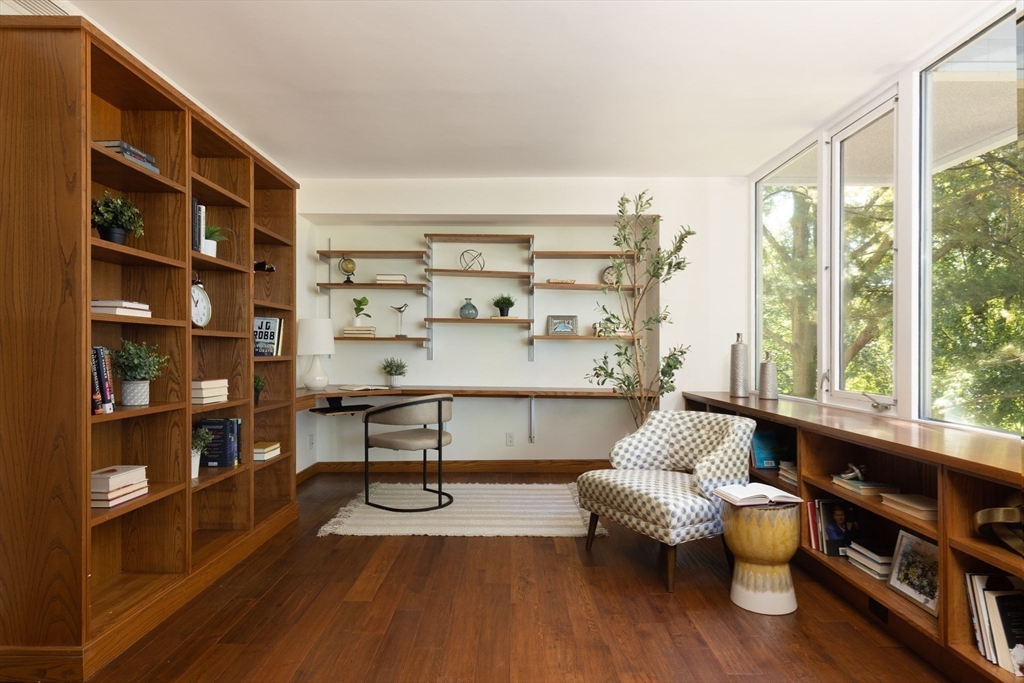 975 Memorial Drive, Unit 209 Cambridge, MA 02138 - Photo 17 of 23 a living room with furniture and a wooden floor