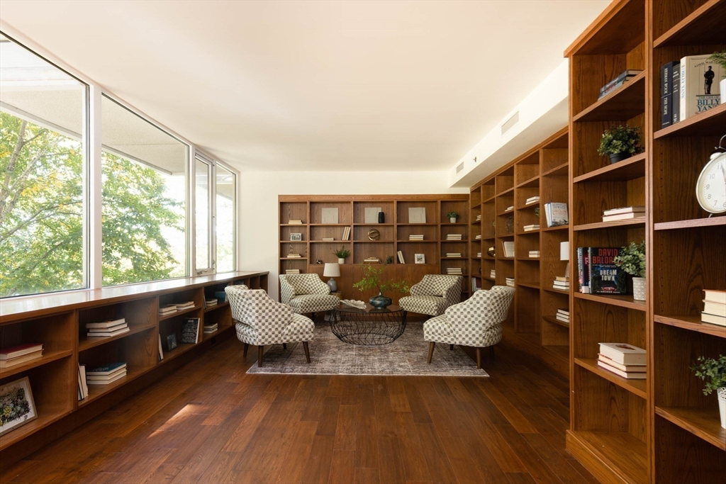 975 Memorial Drive, Unit 209 Cambridge, MA 02138 - Photo 18 of 23 a living room with furniture window and wooden floor