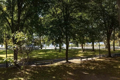 a view of a chairs and table in the patio in front of building