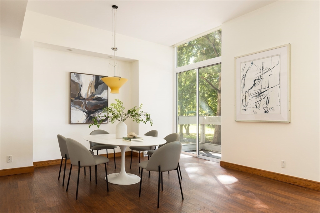 975 Memorial Drive, Unit 209 Cambridge, MA 02138 - Photo 6 of 23 a view of a dining room with furniture window and outside view