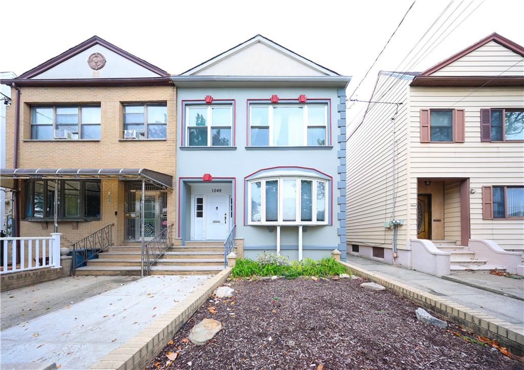 1049 Bay Ridge Parkway Brooklyn, NY 11228 - Photo 2 of 41 a front view of a house with garden