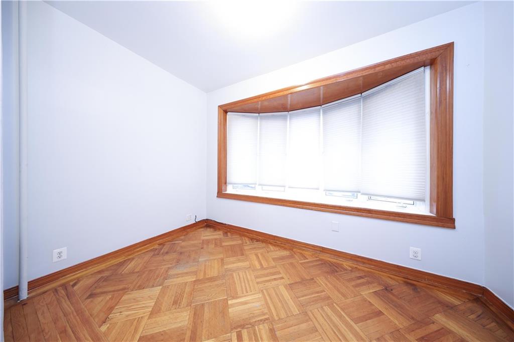 1049 Bay Ridge Parkway Brooklyn, NY 11228 - Photo 28 of 41 a view of a small space with wooden floor and a window