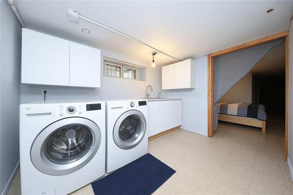 1049 Bay Ridge Parkway Brooklyn, NY 11228 - Photo 33 of 41 a view of kitchen and utility room with washer and dryer