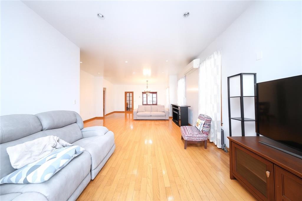 1049 Bay Ridge Parkway Brooklyn, NY 11228 - Photo 8 of 41 a living room with furniture and a flat screen tv