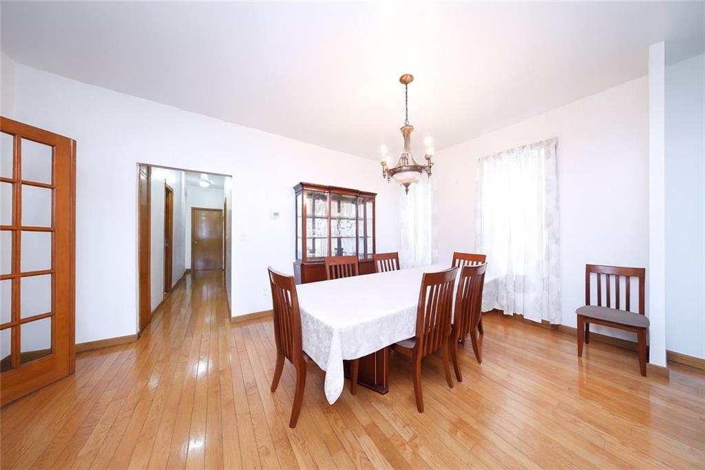 1049 Bay Ridge Parkway Brooklyn, NY 11228 - Photo 9 of 41 a view of a dining room with furniture window and wooden floor