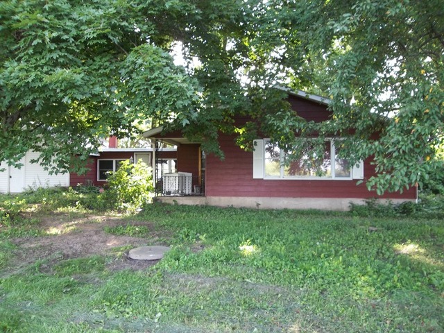 1252 South Ridge Road Oregon, IL 61061 - Photo 1 of 14 a front view of a house with garden