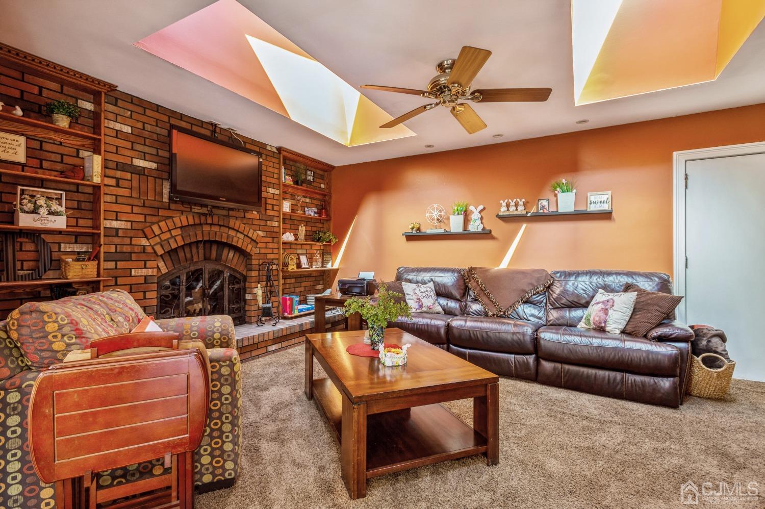 11 Boxwood Road Piscataway, NJ 08854 - Photo 12 of 28 a living room with furniture a ceiling fan and a rug