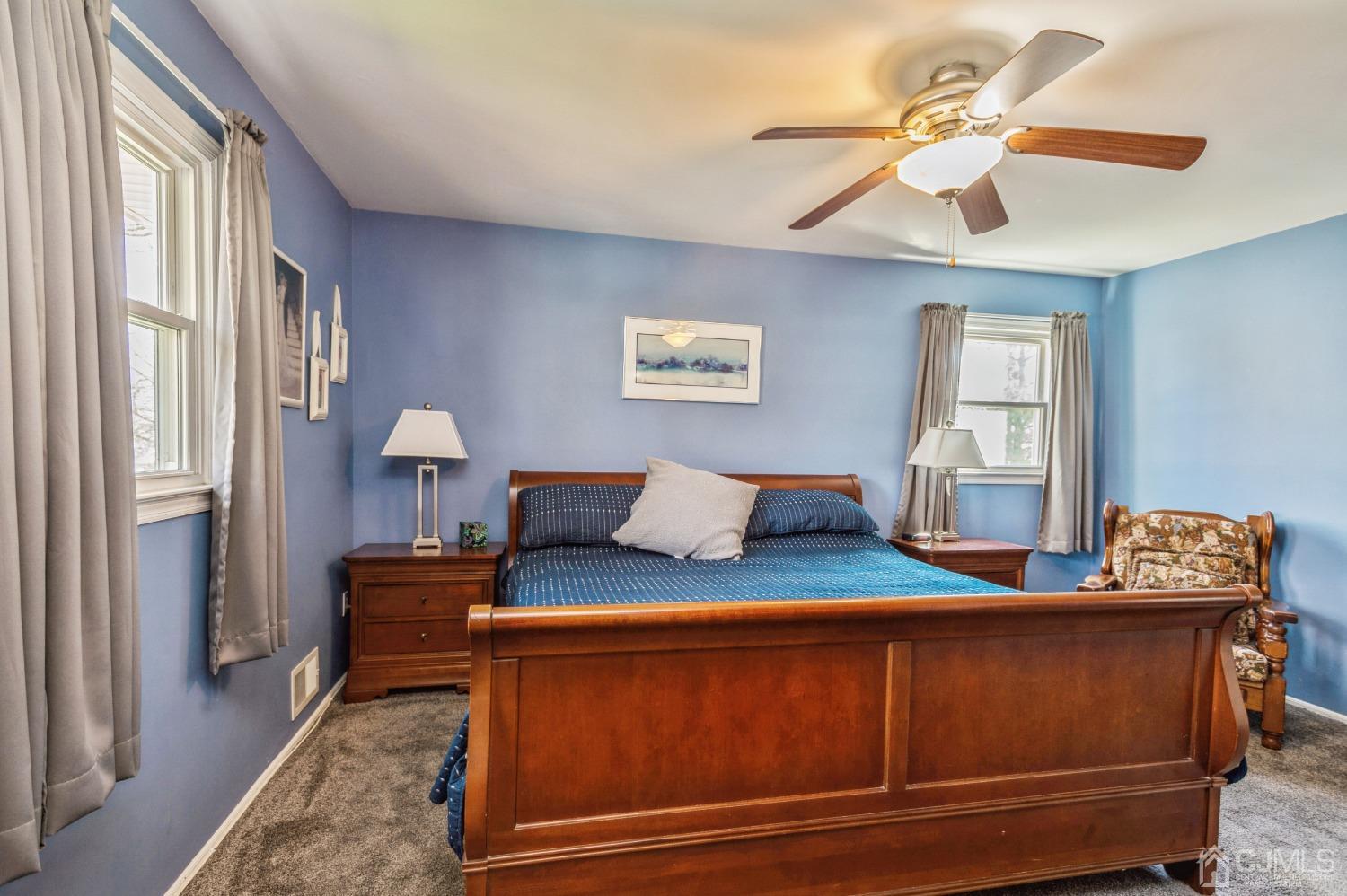 11 Boxwood Road Piscataway, NJ 08854 - Photo 17 of 28 a bedroom with a bed and a chandelier