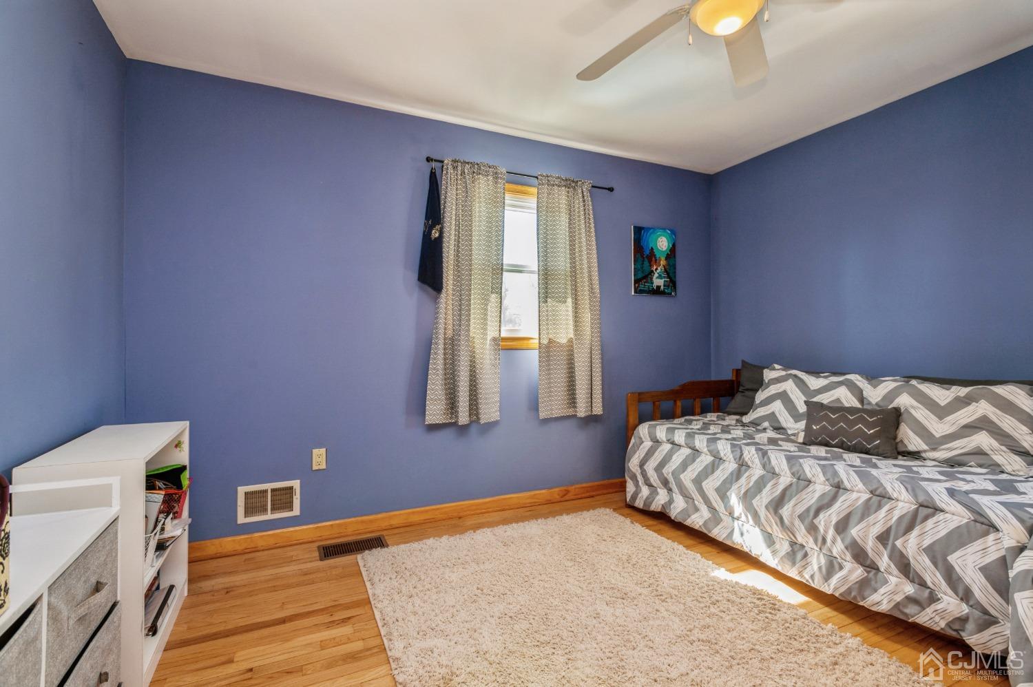 11 Boxwood Road Piscataway, NJ 08854 - Photo 19 of 28 a bedroom with a bed and a window