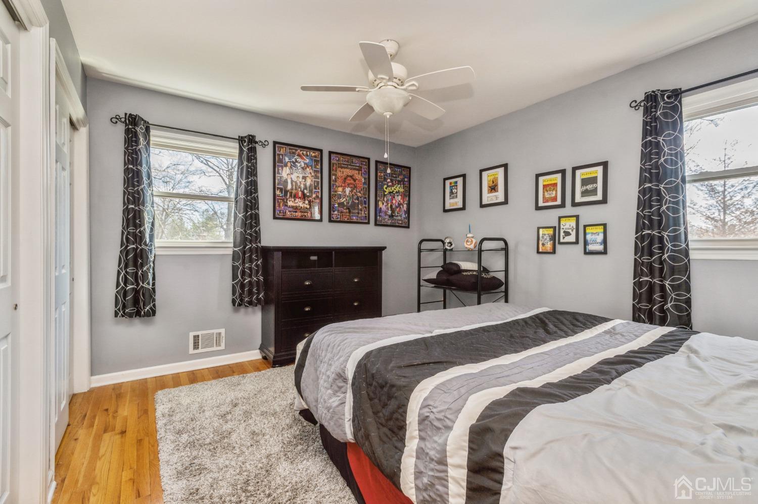 11 Boxwood Road Piscataway, NJ 08854 - Photo 20 of 28 a bedroom with a large bed and a chandelier