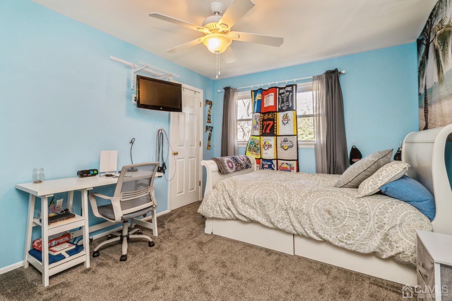 11 Boxwood Road Piscataway, NJ 08854 - Photo 21 of 28 a bedroom with a bed and a flat screen tv