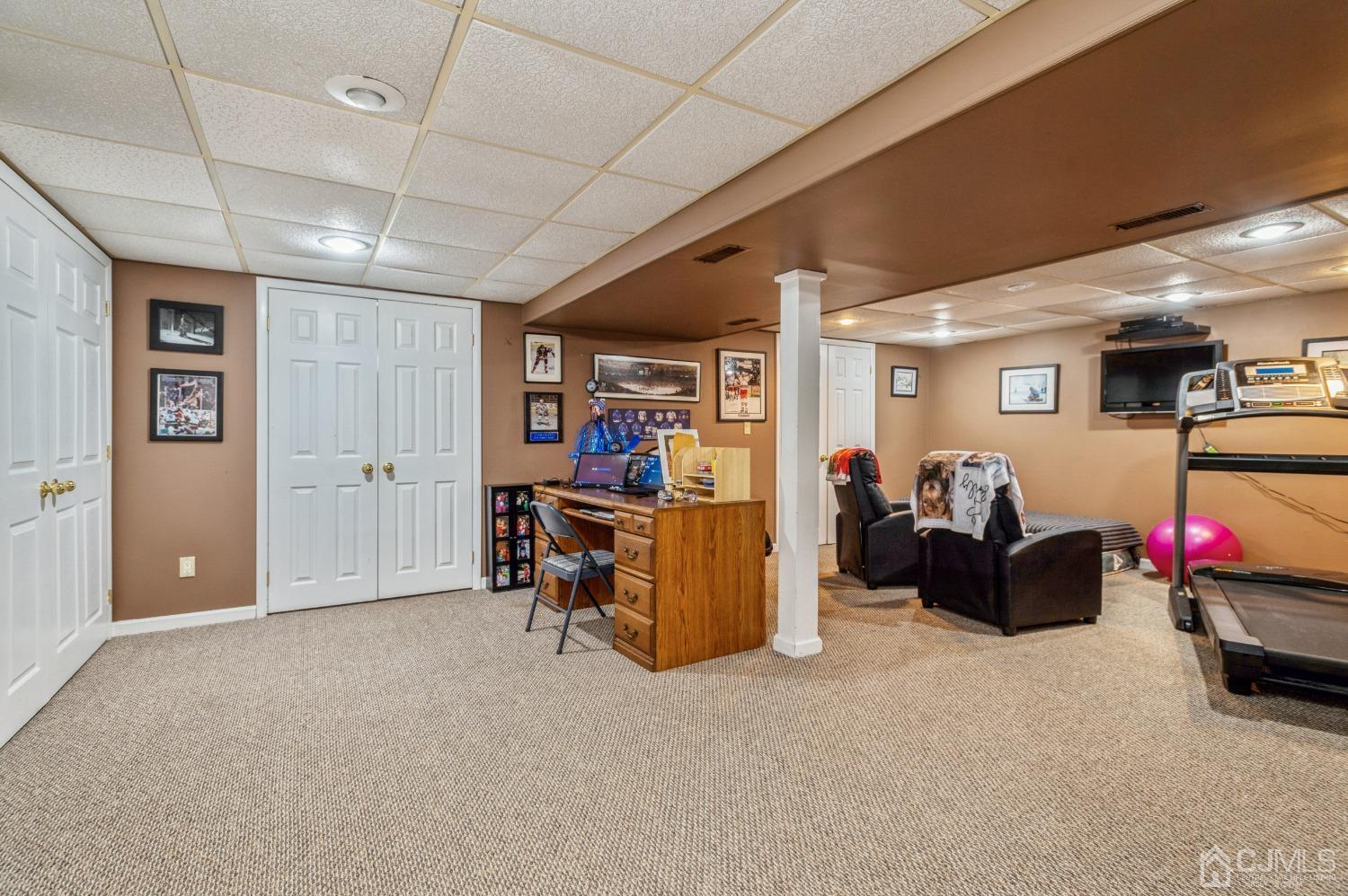 11 Boxwood Road Piscataway, NJ 08854 - Photo 23 of 28 a living room with furniture and a flat screen tv