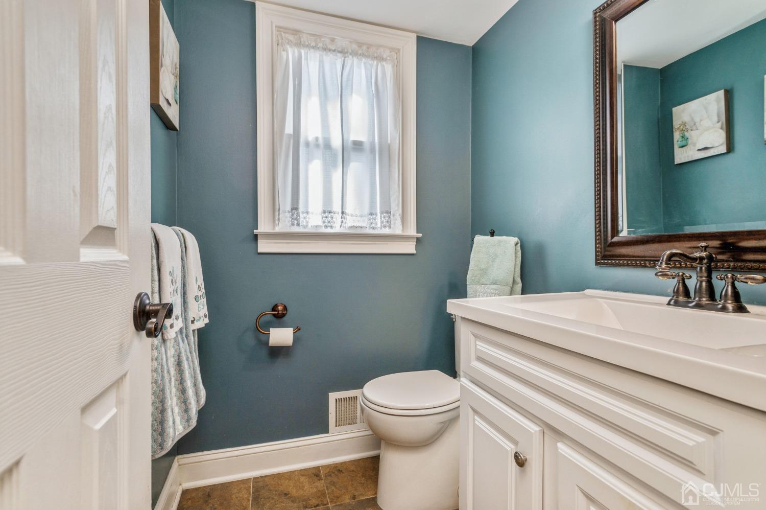 11 Boxwood Road Piscataway, NJ 08854 - Photo 24 of 28 a bathroom with a sink toilet and window