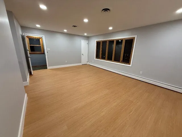 a view of an empty room with a window