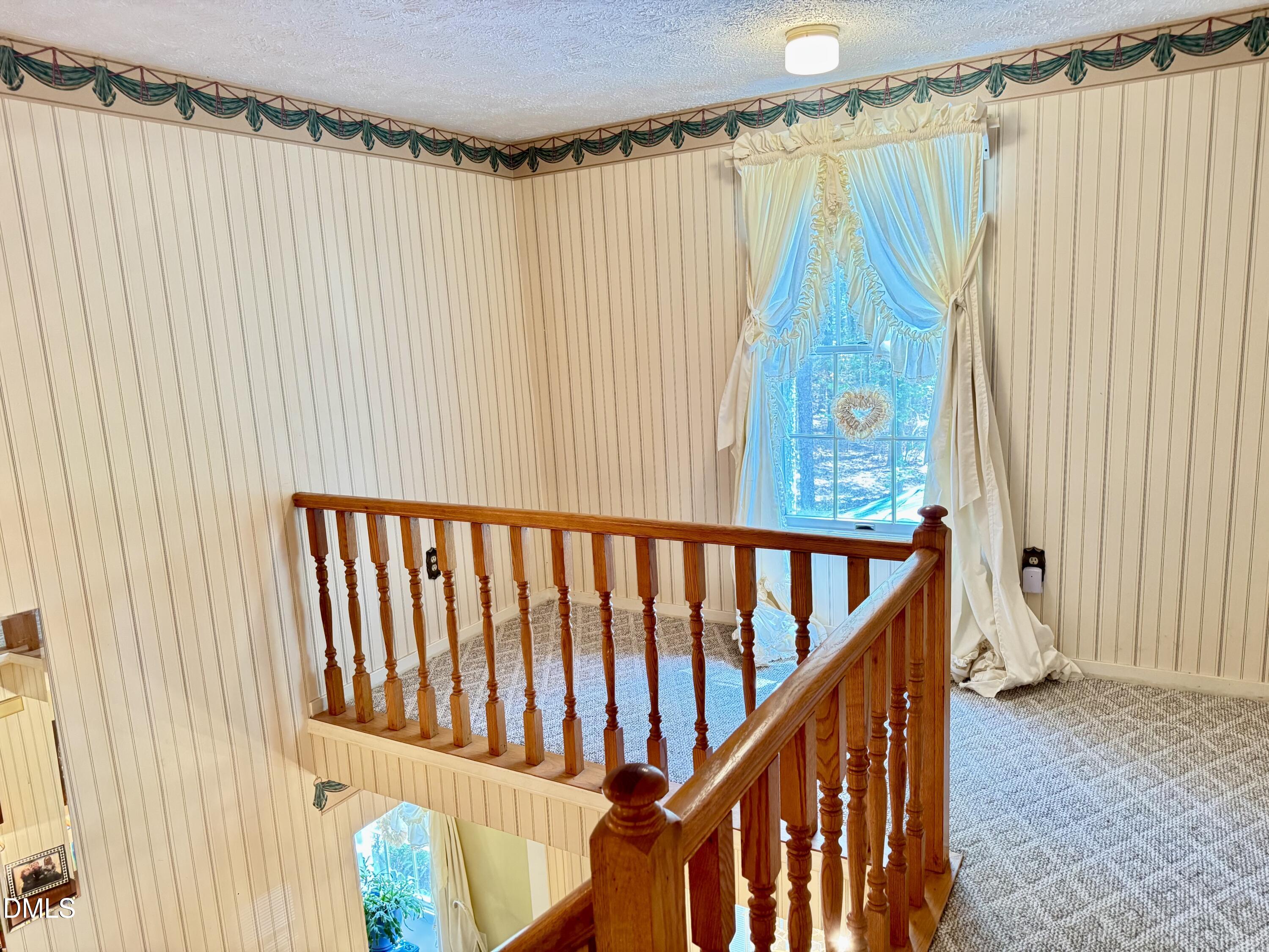 84 Wintergreen Road Henderson, NC 27537 - Photo 35 of 49 a view of a porch with wooden floor and stairs