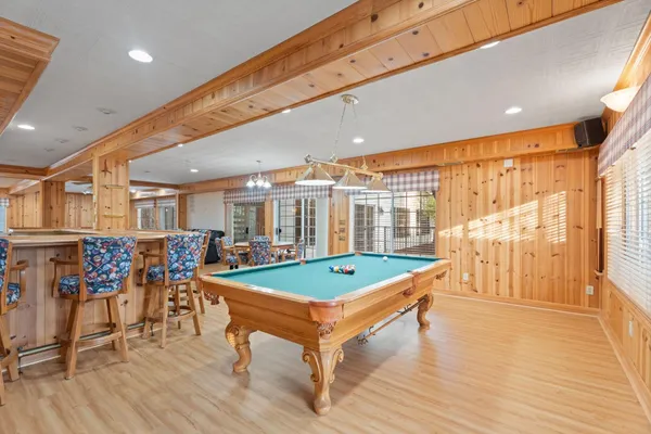 a living room with furniture a dining table and chairs